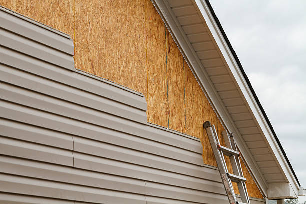 Professional Vinyl Siding technician working in Lawrence, MA